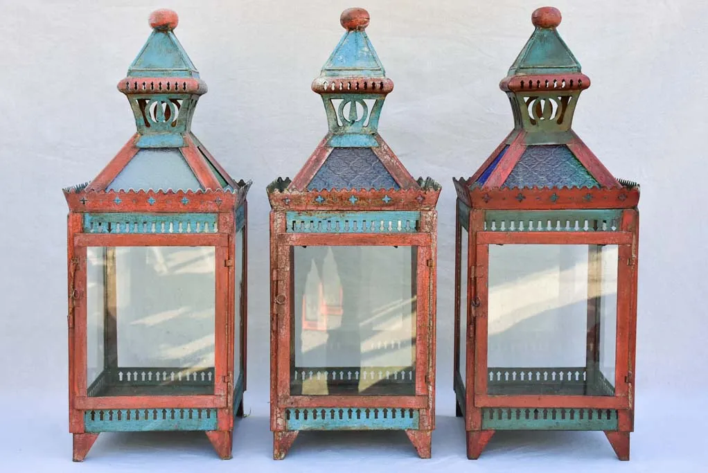 Three large lanterns with colored glass