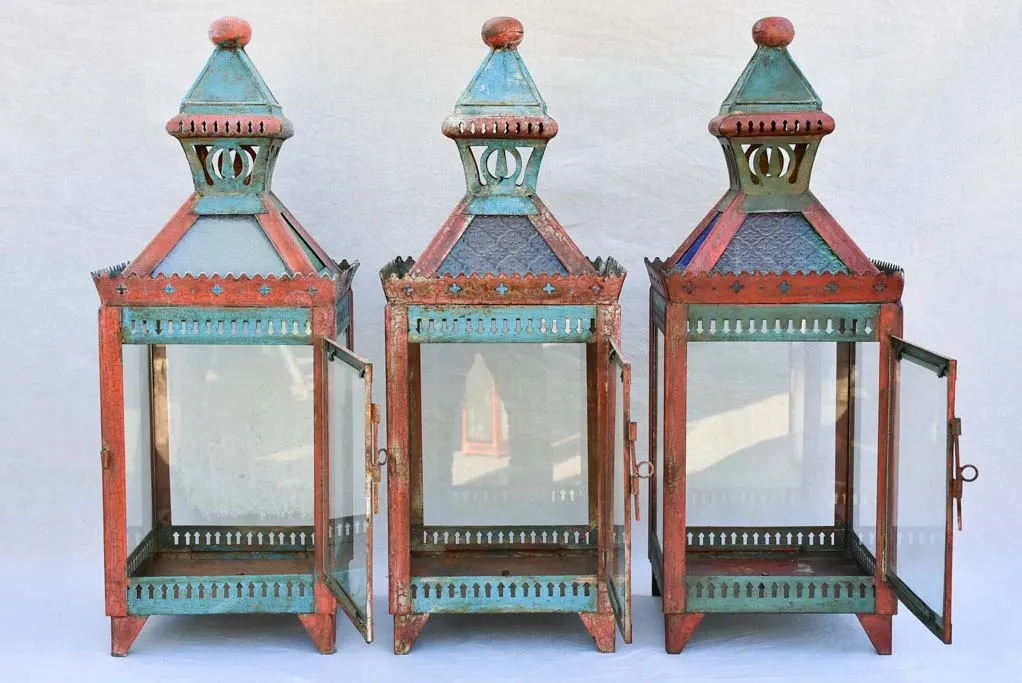 Three large lanterns with colored glass